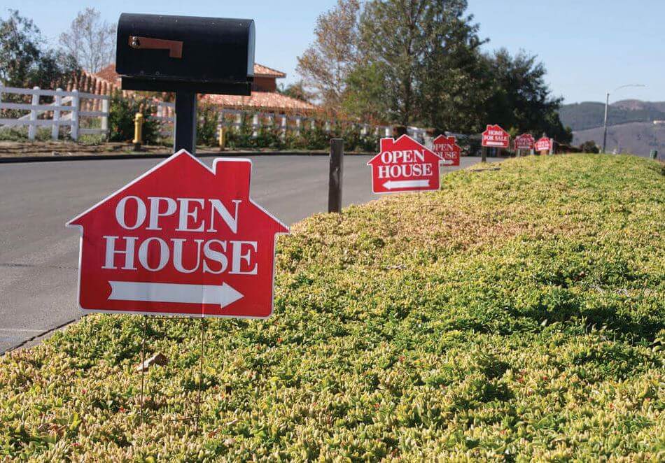 Open House sign on a lawn