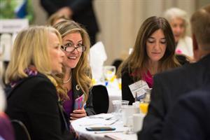 delegates discuss during NVAR politics and pancake event